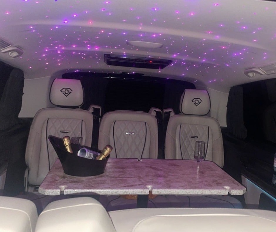 hilton ames limo interior with champagne and purple lights