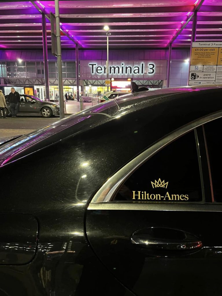 black hilton ames chauffeur vehicle outside terminal 3