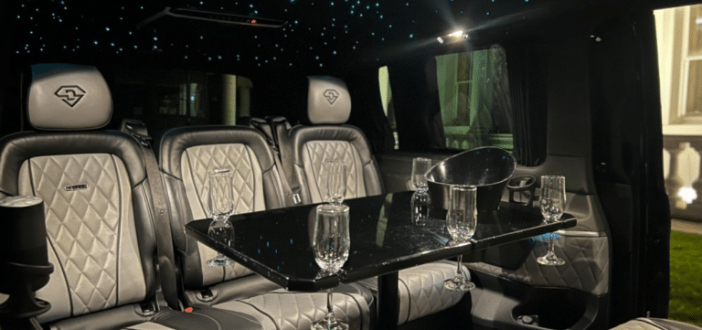 luxury vehicle interior with champagne and glasses