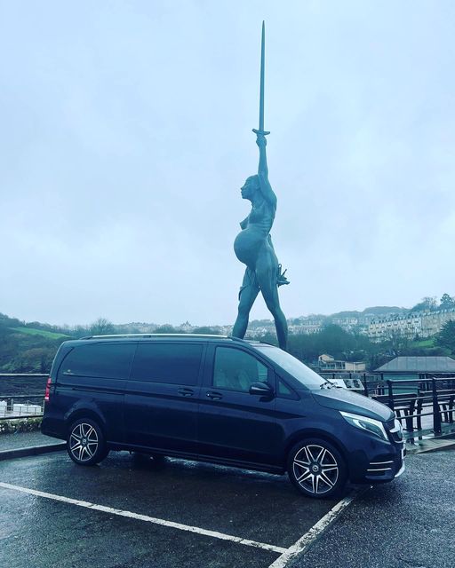 mercedes chauffeur vehicle outside monument in south west